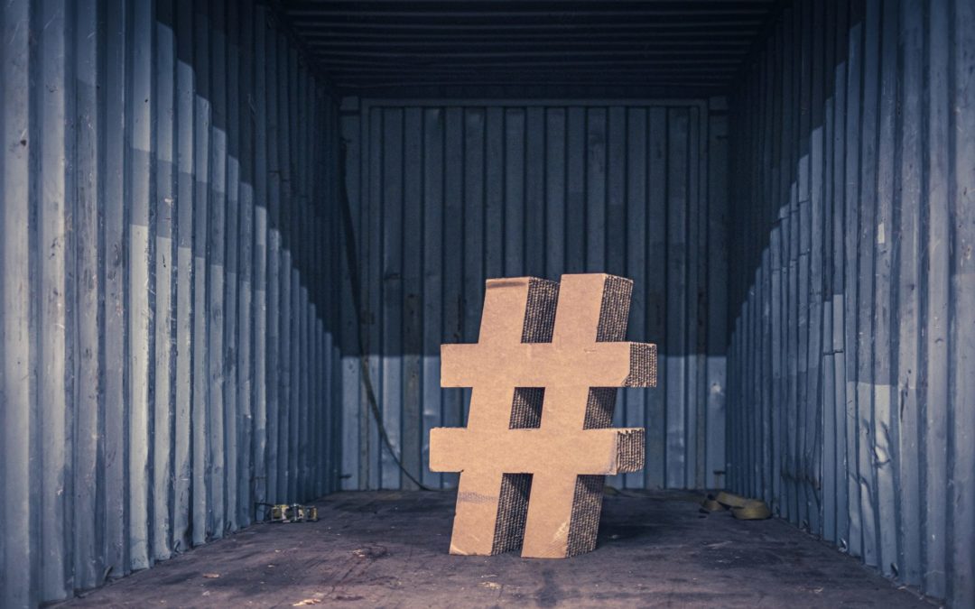 hashtag symbol in an empty room wiht gray metal walls